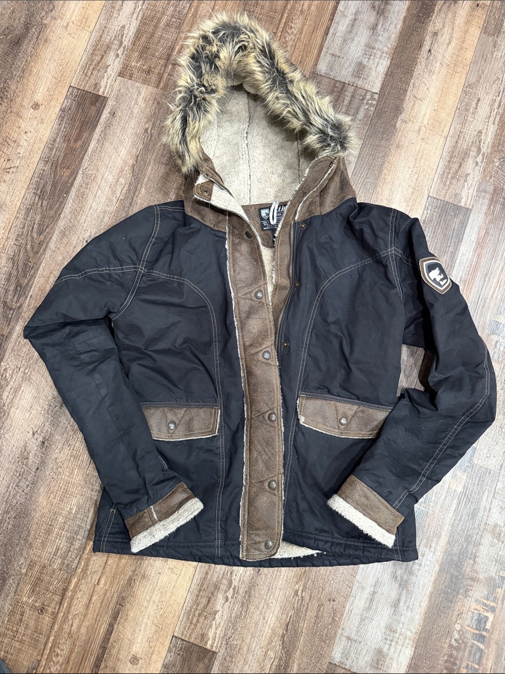 Kuhl Ladies Black Coat with Brown Trim and Faux-Fur Hood
